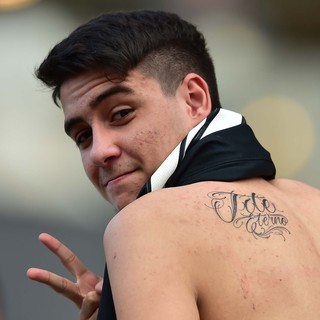 Jovem fez tatuagem em homenagem a Tite (Crédito: Reprodução)