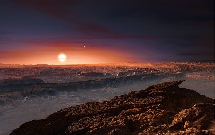 Ilustração mostra como pode ser a superfície do planeta Proxima b, que orbita a estrela Proxima Centauri, a mais próxima do Sol (Crédito: Reprodução)