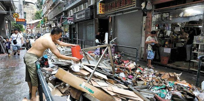 Cidade destruída após tufão (Crédito: T.Siu/Reuters)